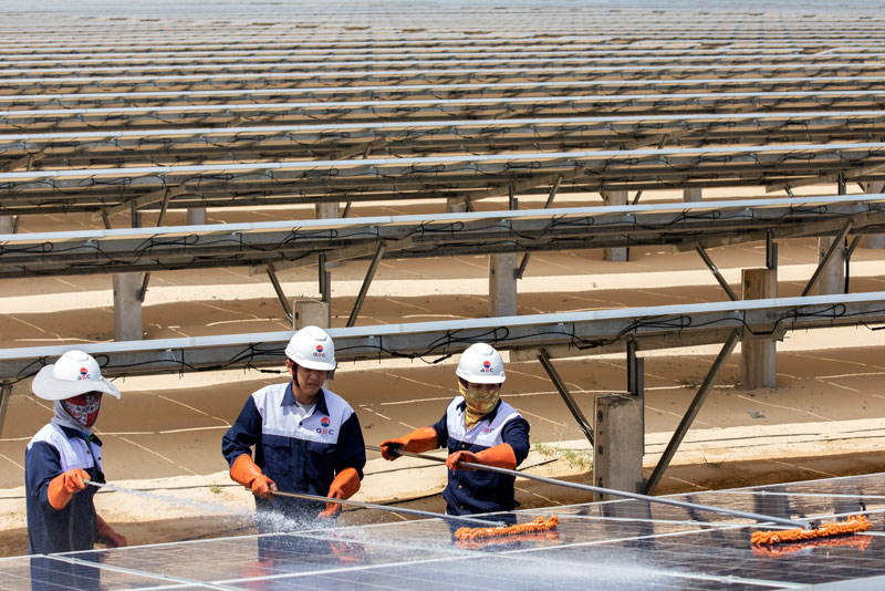 Workers maintain 145,560 solar panels that spread across 45 hectares at the Phong Dien solar plant, in Phong Dien District, Thua Thien-Hue Province, Vietnam.